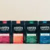 all four bags of barrel aged coffees from cooper's cask coffee showing the end product for how we make our barrel aged coffee