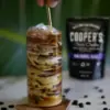 a glass with a coffee drink and coffee bean bag as example of one of the top 5 coffee cocktail recipes