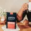 African American man enjoying Cooper's Cask Coffee as one of his coffee gifts for dad