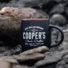 pic of cooper's cask coffee cup on rocks to show earthy side of their single-origin coffees